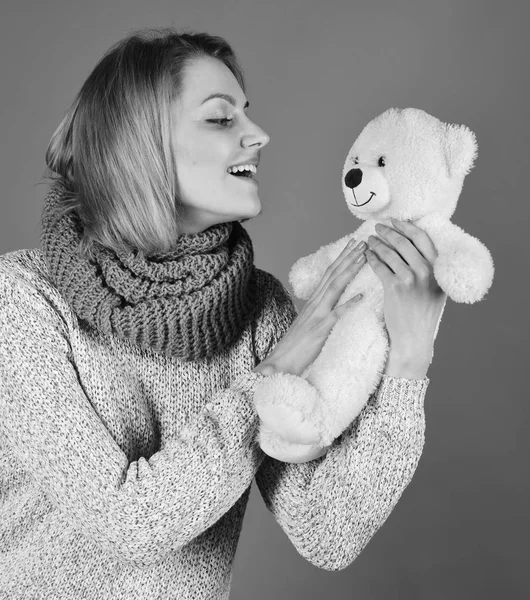 Toy store or toy shop. Childish mood concept. Woman holds teddy bear
