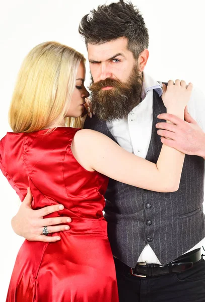 Dancing couple concept. Woman in red dress and man in vest cuddling while dancing. Bearded hipster and attractive lady at dancing contest. Couple in love, dancers in elegant clothes, white background