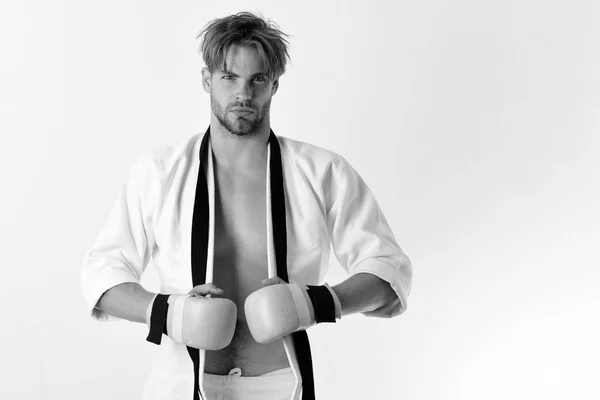 Karate man. Handsome young muscular sportsman with boxing gloves — Stock Photo, Image