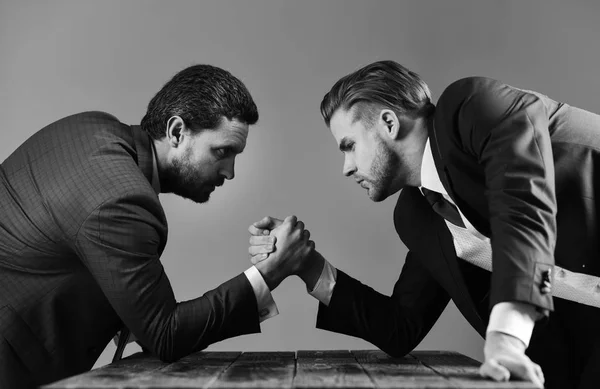 Waist-up portrait of two angry businessmen in suits — Stock Photo, Image