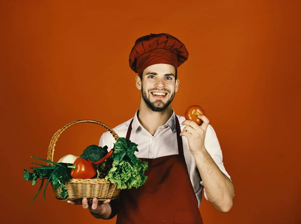 Man with beard on red background. Cooking concept. — Stock Photo, Image