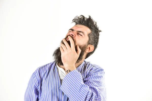 Morning yawning concept. Guy covering mouth with hand, copy space. — Stock Photo, Image