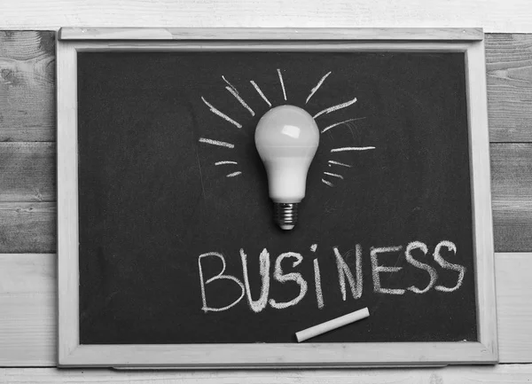 Business idea concept. White lamp as symbol of successful business idea.
