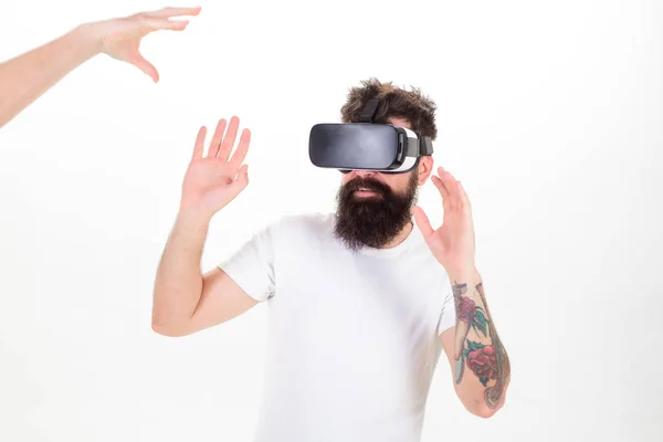 Man with beard and tattoo making protective gesture against male contestant in virtual reality computer game, gaming concept. Bearded man with scared face in VR goglers isolated on white background — Stock Photo, Image