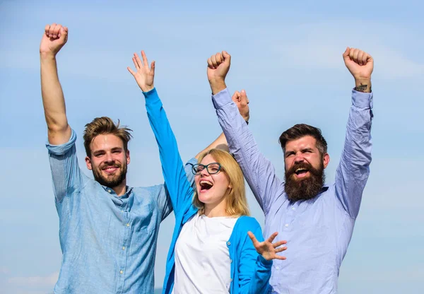 Freedom concept. Company three happy colleagues office workers enjoy freedom, sky background. Men with beard in formal wear and blonde in eyeglasses finished work. Employees enjoy feeling of freedom — Stock Photo, Image