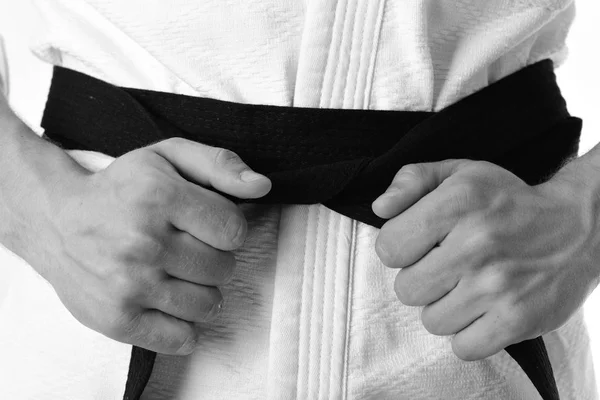 Guy poses in white kimono with black belt, close up. — Stock Photo, Image
