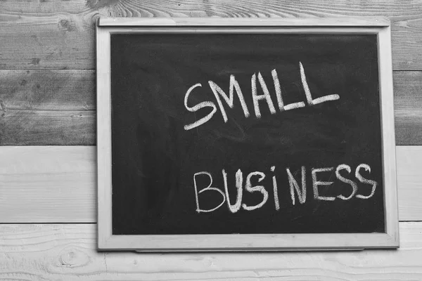 Small business type concept. Chalkboard written with small business on wooden background. — Stock Photo, Image