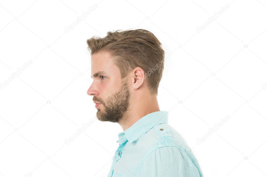 Profile of man with beard on unshaven face isolated on white background. Handsome man in blue shirt, fashion. Bearded and stylish. Hair and barber salon. Skin care and grooming. Casual in style