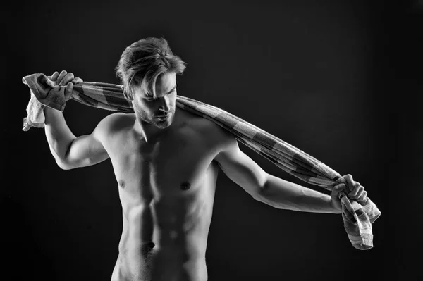 Sexy athlete wipe with towel after training. Sportsman with fit bare torso. Man with six pack and ab muscles. Sport and fitness. Hygiene or health and bodycare concept, black and white — Stock Photo, Image