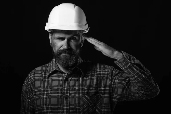 Man with satisfied face expression isolated on black background. Construction and hard work concept. Worker with brutal image