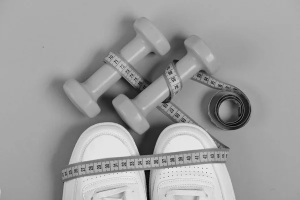 Sport shoes and equipment for healthy shape. Centimeter on trainers — Stock Photo, Image