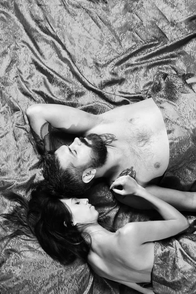 Perfect morning and sex. Man with beard and sleepy face has romantic morning
