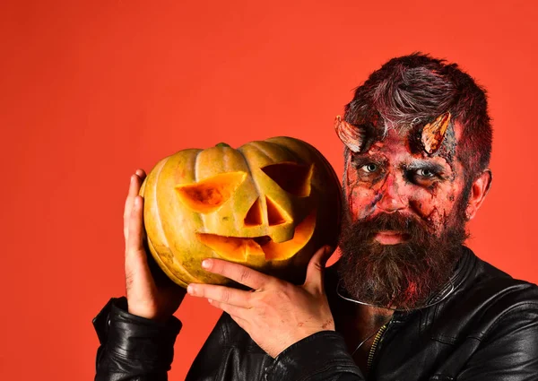 Devil or monster with October decorations. Man wearing scary makeup — Stock Photo, Image