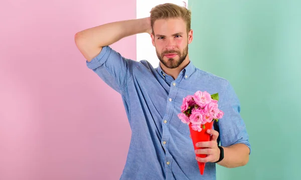 This is for you Boyfriend happy holds bouquet flowers. Man ready for romantic date bring bouquet pink flowers. Macho gives flowers as romantic gift. Guy bring romantic pleasant gift to give