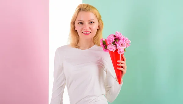 Feeling so special. Girl holding bouquet flowers enjoy favorite fragrance. Lady happy received favorite flowers as gift feeling lovely and special. Woman smiling likes to feel special attend to her