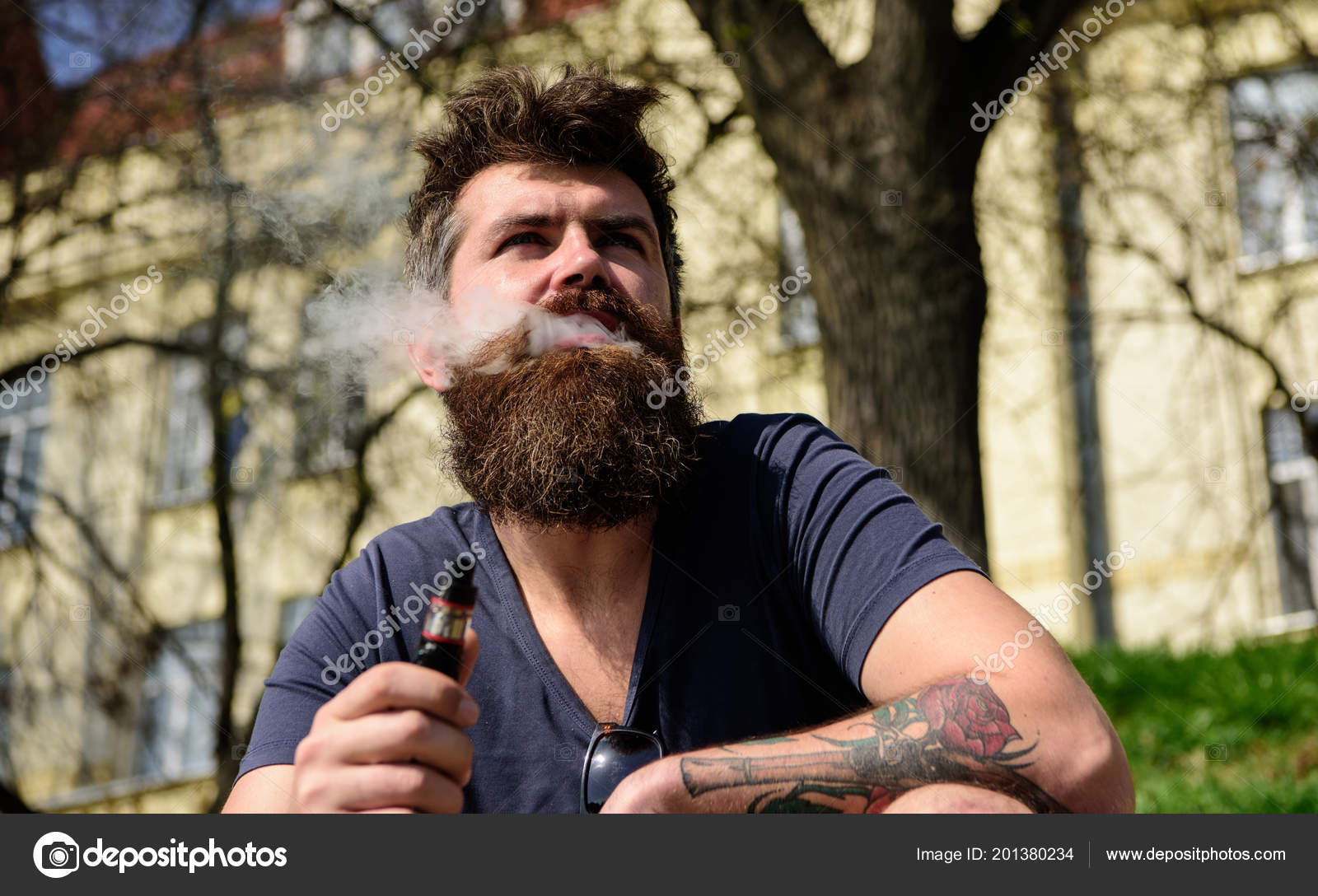 Hipster With Tousled Hair And Gray On Relaxed Dreamy Face With