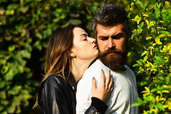 Man and woman with romantic faces on autumn trees background. — Stock Photo, Image