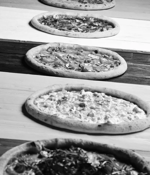 Take away food with various ingredients and crunchy edges. Different pizzas set for menu. Pizza circles with meat, mushrooms, — Stock Image Take away food with various ingredients and crunchy edges. Different pizzas set for menu. Pizza circles with meat, mushrooms, Stock Photo