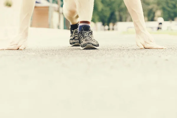 Trainers of runner starting his marathon on flat treadmill — Stock Photo, Image