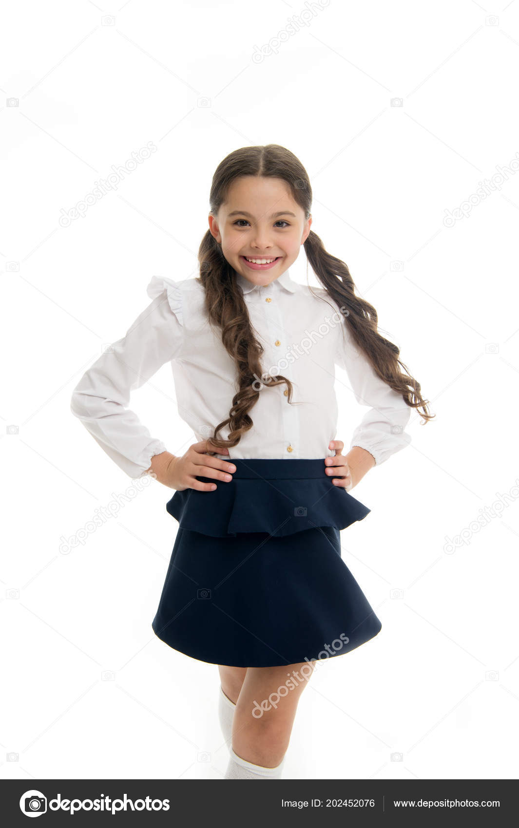 Happy schoolgirl. Hairstyle for schoolgirl nice and easy. Gorgeous tails  perfect for every day of week. Cute everyday back to school hairstyles.  Schoolgirl happy smiling pupil long curly hair Stock Photo by ©
