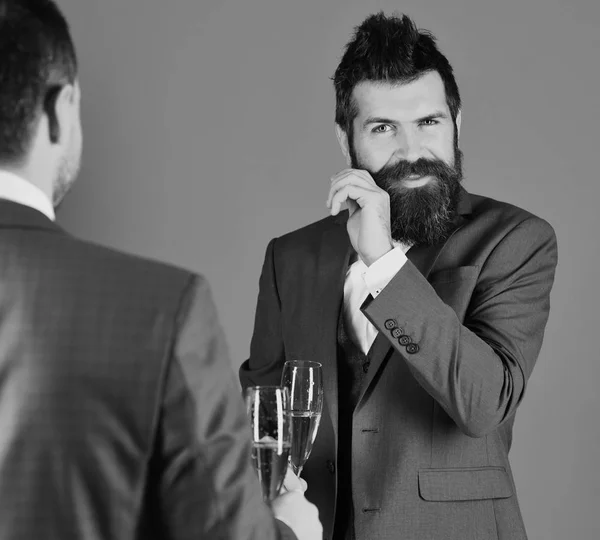 Men in smart suit on blue background. Managers with beards