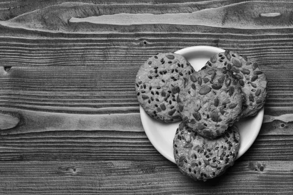 Traditional snack for tea time. Pastry and homemade goods concept. Cookie made of oatmeal on wooden background — Stock Photo, Image