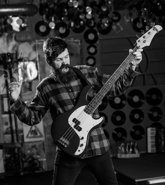 Musician play electric guitar. Musician, frontman, soloist, singer play guitar in music club on background. Rock musician concept. Man on shouting face play guitar, singing song, play music — Stock Photo, Image