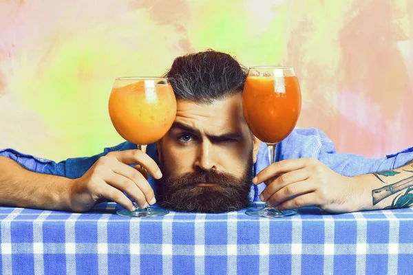 Brutal caucasian hipster with moustache between tropical alcoholic fresh cocktails — Stock Photo, Image