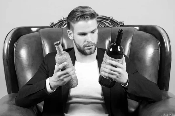Guy choose wine to drink, choice