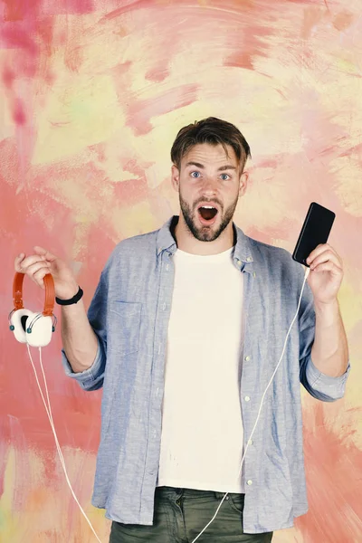 American handsome bearded guy with headphones.