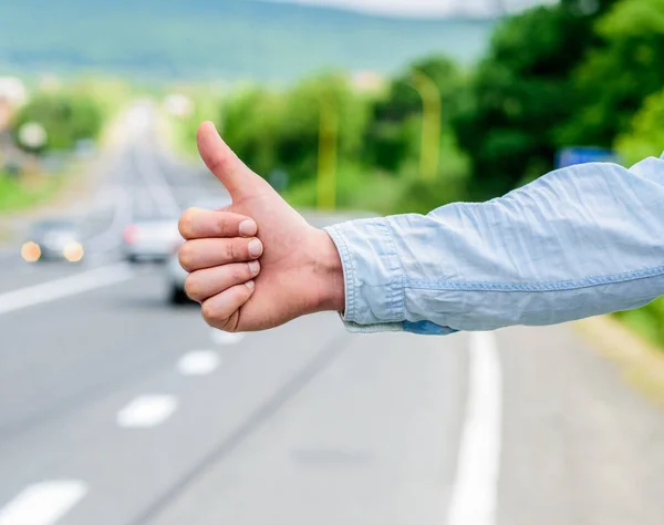 Cultural difference. Thumb up inform drivers hitchhiking. But in some cultures gesture offensive risk to be killed by furious driver you just insulted. Hitchhiking culture. Thumb up gesture meaning