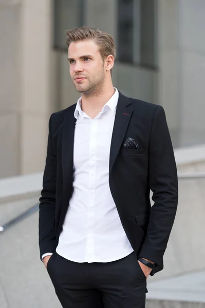 Successful and stylish. Man well groomed elegant formal suit walks urban background. Businessman stylish successful office worker confident face. Businessman successful walk during lunch time