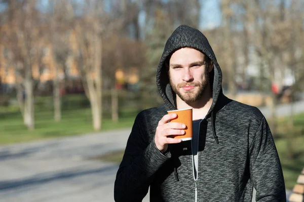 But first coffee. Man morning jog drinks coffee urban background. Taking moment enjoy day. Sportsman relaxing with coffee morning time. Guy handsome attractive sportsman relaxing outdoor