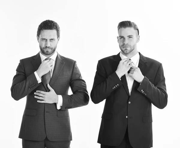 Businessmen with serious faces wears classic suits on white back — Stock Photo, Image