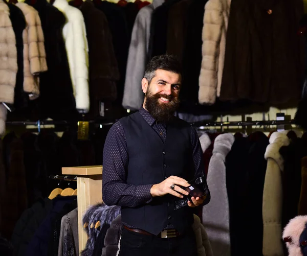 Man with beard and mustache in fashion fur shop. — Stock Photo, Image