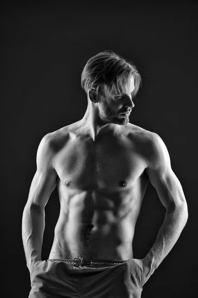 Sportsman with sexy torso and chest. Training and workout activity in gym. Athlete with fit body in shorts. Man with six pack and ab muscles. Sport or fitness and bodycare concept, black and white — Stock Photo, Image