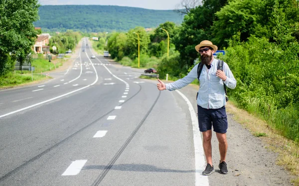 Stop car. Man try stop car thumb up. Hitchhiking one of cheapest ways traveling. Picking up hitchhikers. Hitchhikers risk being picked up by someone who is unsafe driver or personally dangerous — Stock Photo, Image