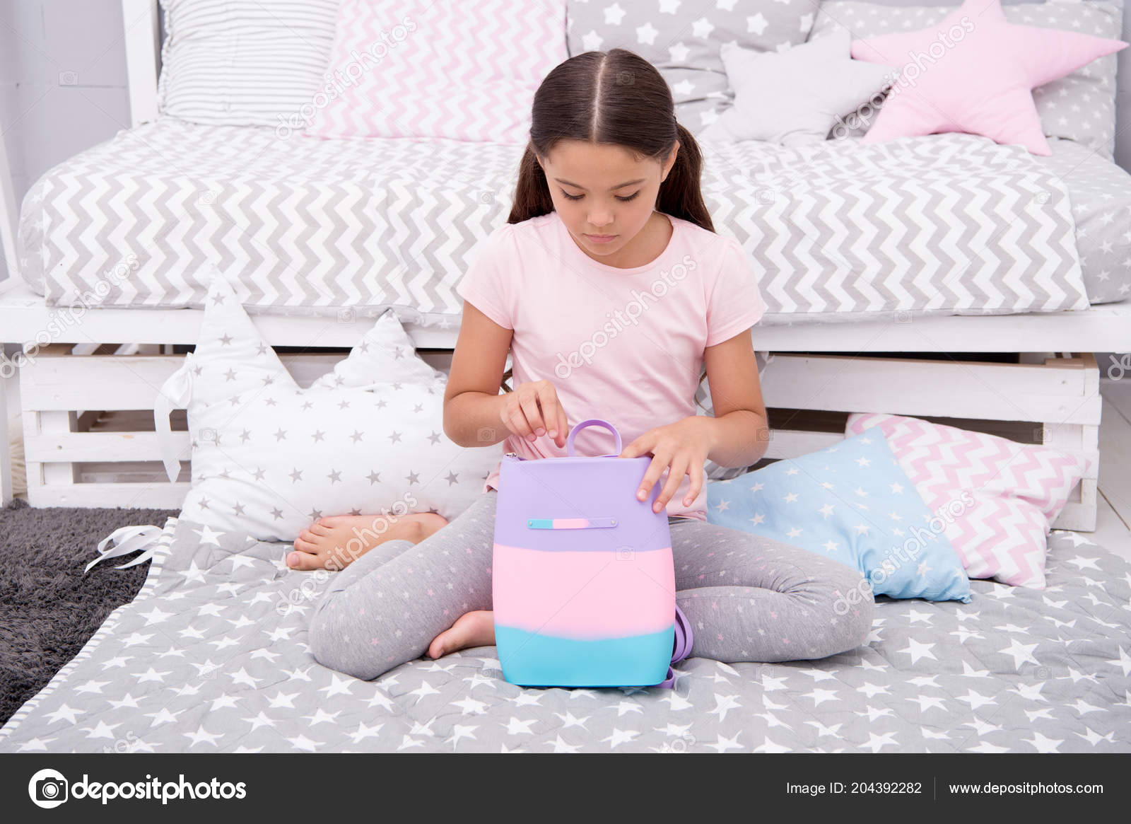 Prepare bag for Girl child sit on bed with bag or
