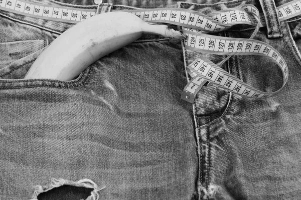 Health and male sexuality concept: banana sticking out of pocket — Stock Photo, Image
