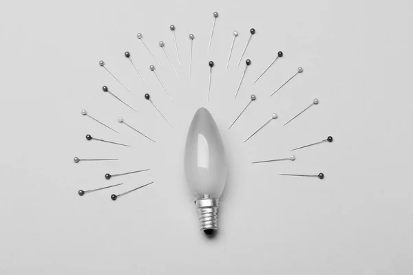 Light bulb in oval form as center of composition — Stock Photo, Image