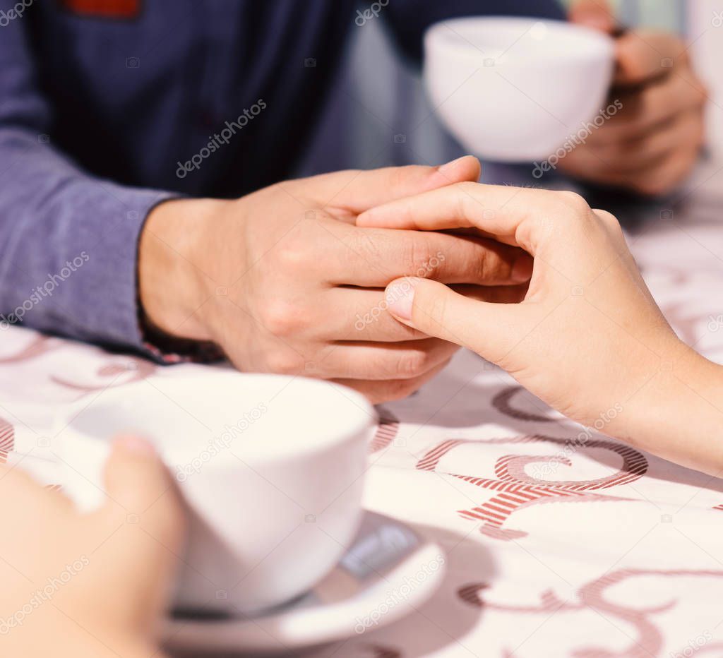 Woman and man have a date. Male and female hands on table. Rendezvous and coffee break