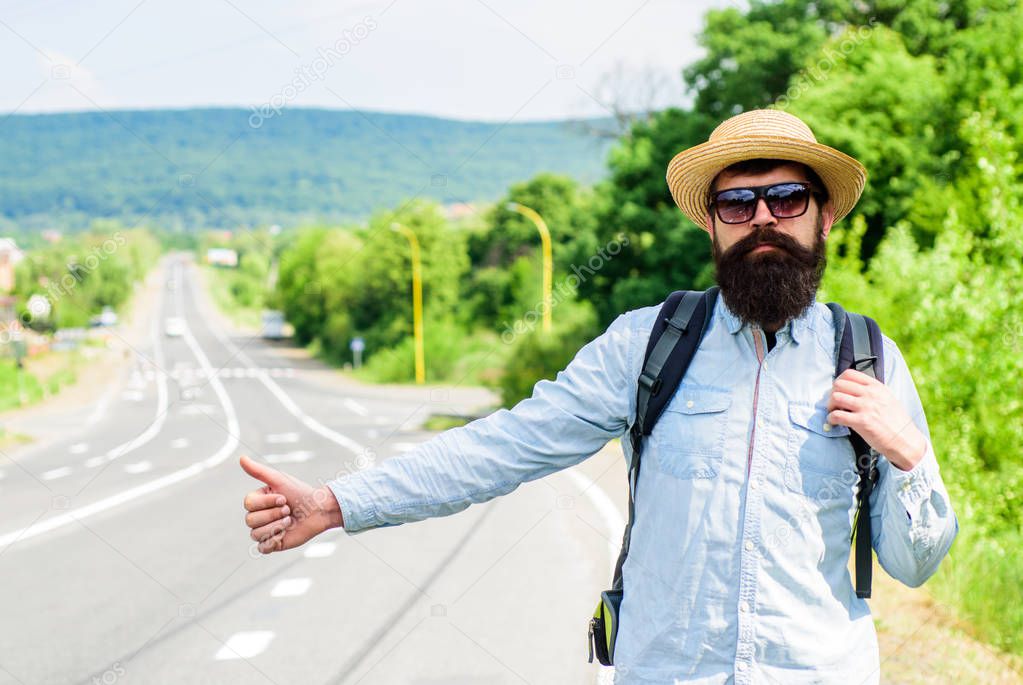 Hitchhiker with special gesture. Man try stop car thumb up. Hitchhiking one of cheapest ways traveling. Hitchhikers risk being picked up by someone who is unsafe driver or personally dangerous