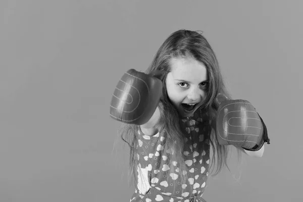 Child boxer with long hair in dress with heart print — Stock Photo, Image