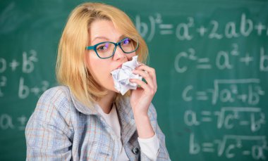 Thirst of knowledge. Hungry for knowledge. She ready to eat her paperwork. Woman teacher eats crumpled piece of paper chalkboard background. Teacher eats piece of paper with mistake failed test clipart