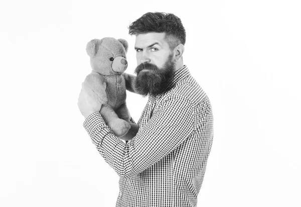 Greediness concept. Miserly hipster holds his toy. Guy with beard does not like to share soft toy. — Stock Photo, Image