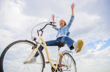 Pedaling towards happiness. Woman feels happy while enjoy cycling. Girl rides bicycle sky background. How cycling changes your life and make you happy. Reasons to ride bicycle. Mental health benefits