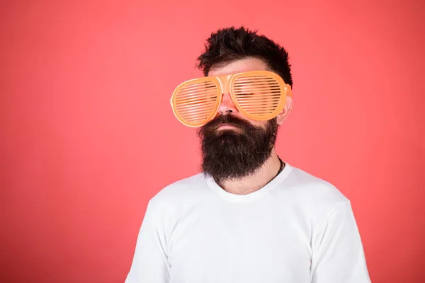 Optics and eye protection concept. Sunglasses party attribute and stylish accessory. Man bearded hipster wears giant louvered sunglasses. Hipster wear shutter shades sunglasses. Fashionable accessory