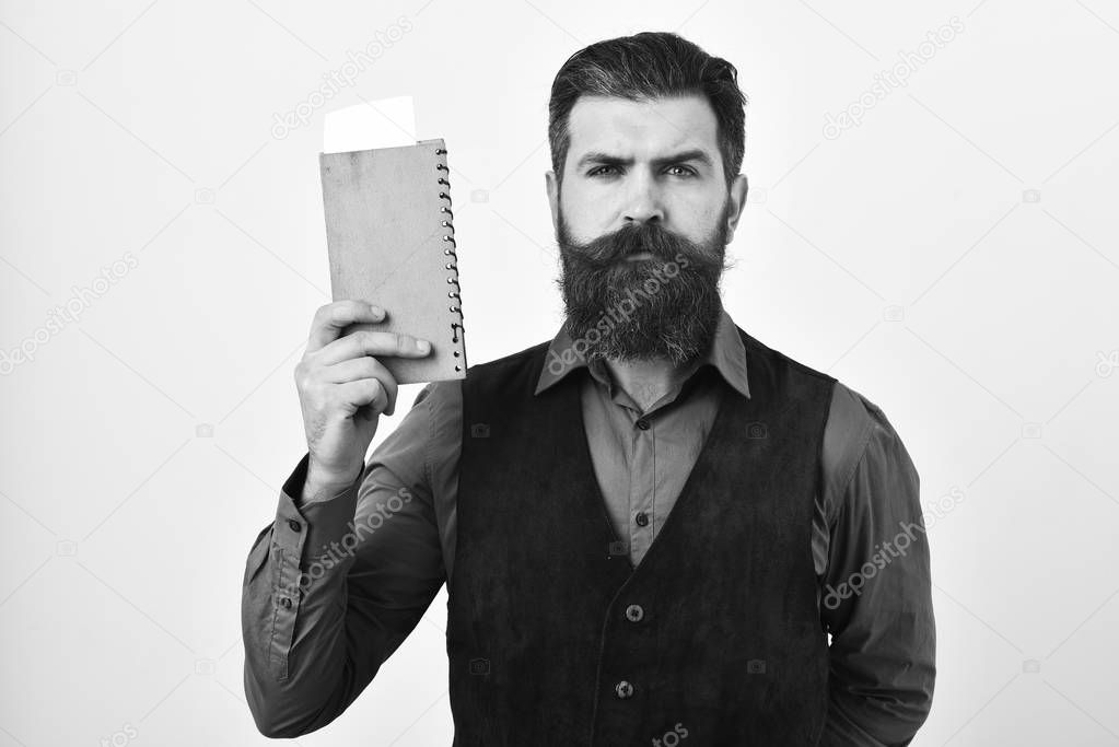 Waiter with check book, defocused. Barman with confident face brings order or change