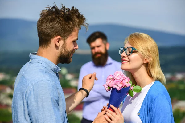 Couple in love dating while jealous husband fixedly watching on background. Unrequited love concept. Couple romantic date lover present bouquet flowers. Lovers meeting outdoor flirt romance relations — Stock Photo, Image