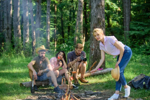 Company friends having hike picnic nature background. Summer picnic. Tourists hikers relaxing while having picnic snack. Picnic with friends in forest near bonfire. Hikers relaxing during snack time.